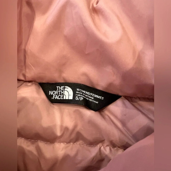 The north face 
Pink puffer vest 
Pilling on inside, Small stains on front - Picture 4 of 9